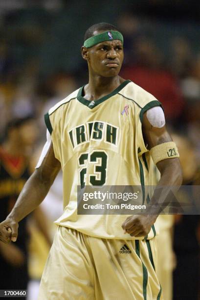 LeBron James of St. Vincent-St. Mary High School clenches his fists after making a shot against Oak Hill Academy at the Cleveland State University...