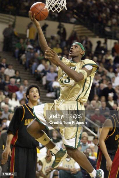LeBron James of St. Vincent-St. Mary High School shoots a layup against Oak Hill Academy at the Cleveland State University Convocation Center on...