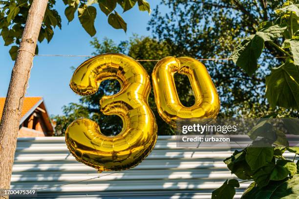 30th birthday balloon sign outdoors - happy birthday banner stock pictures, royalty-free photos & images