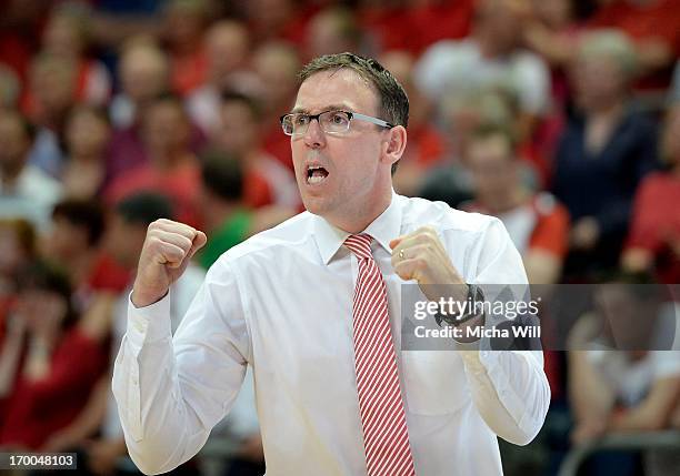 Head coach Chris Fleming of Bamberg raises his fists during game 5 of the semifinals of the Beko BBL playoffs between Brose Baskets and FC Bayern...