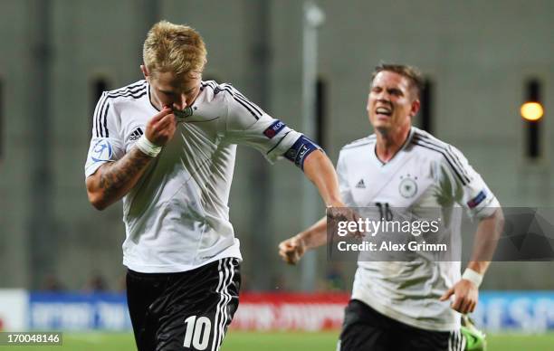 Lewis Holtby of Germany celebrates his team's second goal with team mate Oliver Sorg during the UEFA European Under 21 Championship match between...