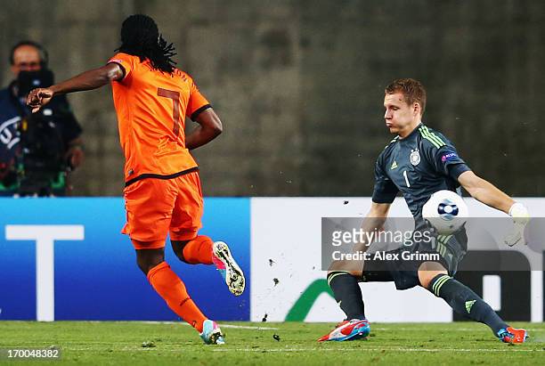 Goalkeeper Bernd Leno of Germany makes a save against Florian Jozefzoon of Netherlands during the UEFA European Under 21 Championship match between...