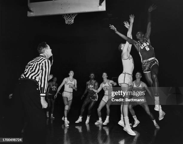 Bill Russell , of the University of San Francisco, scores in the NCAA Playoffs semifinal against Colorado in Kansas City, Missouri, March 18th 1955....
