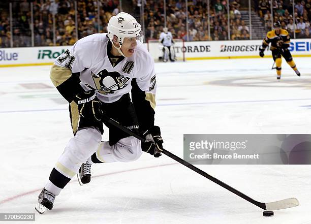 Evgeni Malkin of the Pittsburgh Penguins skates with the puck against the Boston Bruins during Game Three of the Eastern Conference Final of the 2013...