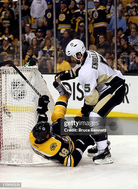 Deryk Engelland of the Pittsburgh Penguins checks Tyler Seguin of the Boston Bruins during Game Three of the Eastern Conference Final of the 2013 NHL...
