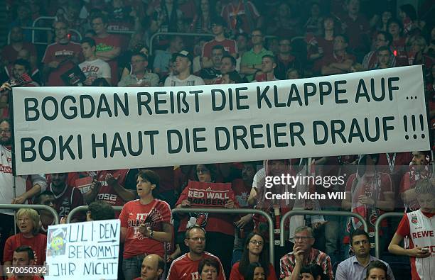 Brose Baskets Bamberg fans lift a banner during game 5 of the semifinals of the Beko BBL playoffs between Brose Baskets and FC Bayern Muenchen at...