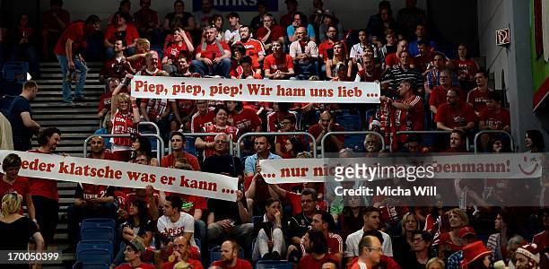 Brose Baskets Bamberg fans lift banners during game 5 of the semifinals of the Beko BBL playoffs between Brose Baskets and FC Bayern Muenchen at...
