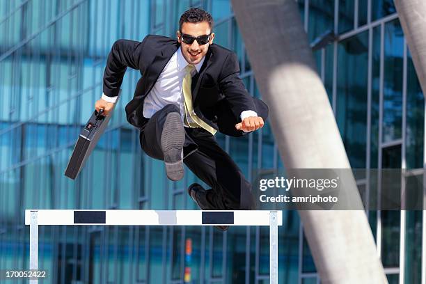 clever dynamic business hurdler - sprinting suit stock pictures, royalty-free photos & images