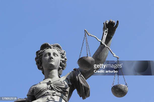 blue sky with ancient lady justice justitia - lady justice stockfoto's en -beelden