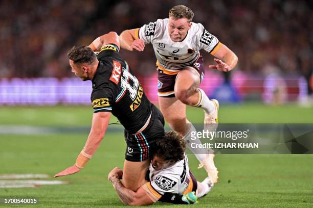 Scott Sorensen of the Panthers is tackled during the 2023 NRL Grand Final match between Penrith Panthers and Brisbane Broncos at Accor Stadium in...