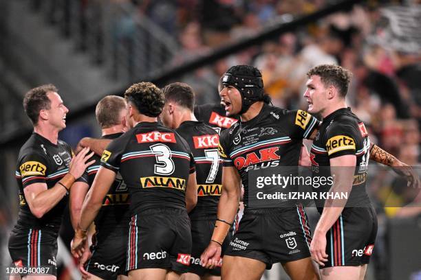 Panthers players celebrates scoring a try during the 2023 NRL Grand Final match between Penrith Panthers and Brisbane Broncos at Accor Stadium in...