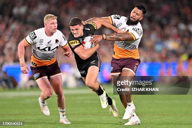 Nathan Cleary of the Panthers is tackled by Payne Haas of the Broncos during the 2023 NRL Grand Final match between Penrith Panthers and Brisbane...
