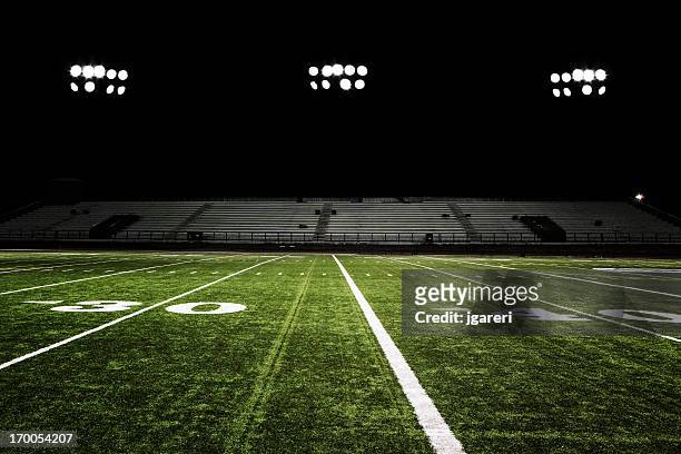 football field at night - american football field stock pictures, royalty-free photos & images