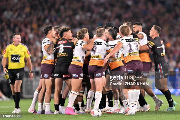 Panthers and Broncos players tussle during the 2023 NRL Grand Final match between Penrith Panthers and Brisbane Broncos at Accor Stadium in Sydney on...