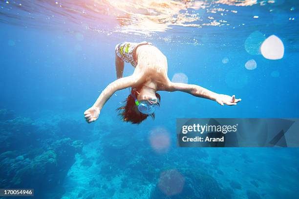 young boy swimming in the sea - boy swimming stock pictures, royalty-free photos & images