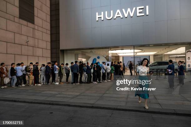 Woman walks out of a Huawei flagship store after the company unveiled new products on September 25, 2023 in Beijing, China. China's Huawei recently...