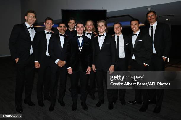 Lachie Neale of the Lions poses for for a photograph with team mates after being awarded the Brownlow Medal during the 2023 Brownlow Medal at The...
