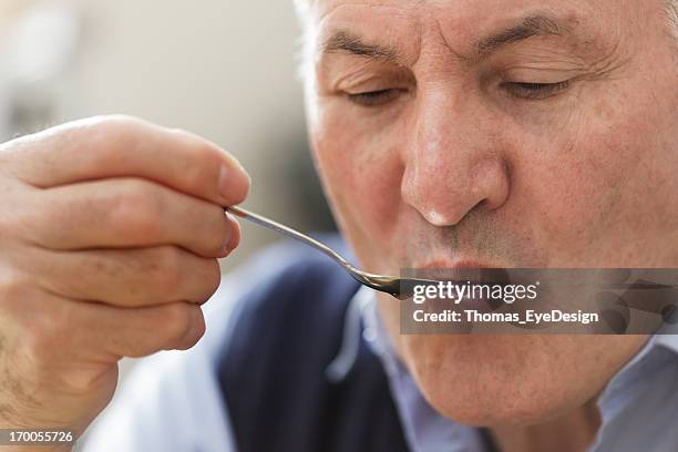 horizontal shot of master taster testing coffee - tasting stock pictures, royalty-free photos & images