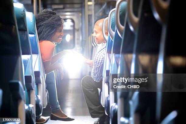 romance on the train - stranger stock pictures, royalty-free photos & images