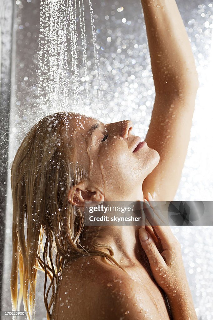 Woman taking a shower.