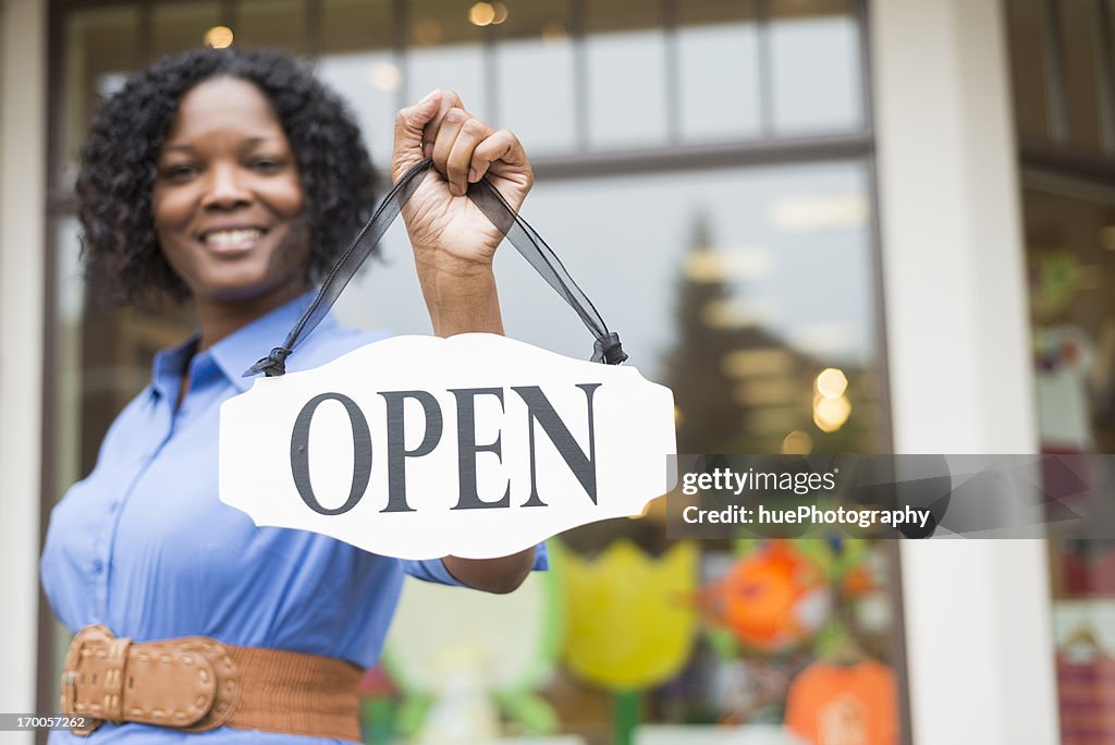 Woman with Open Sign