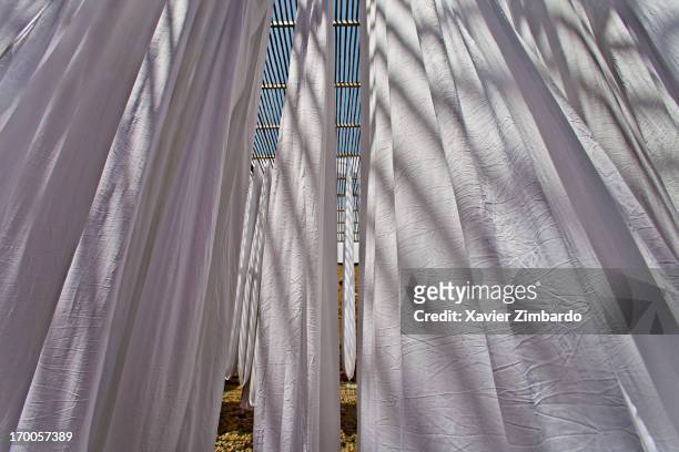 Fabrics being air dried at a dyeing workshop on March 22, 2009 in Rajasthan, India. The long bands of fabric, about ninety yards in length, are...
