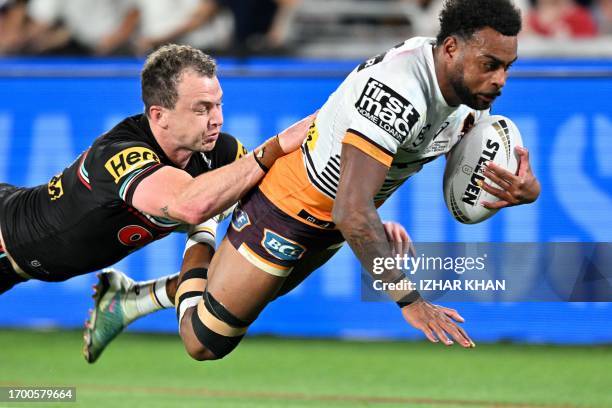 Ezra Mam of the Broncos scoring a try during the 2023 NRL Grand Final match between Penrith Panthers and Brisbane Broncos at Accor Stadium in Sydney...