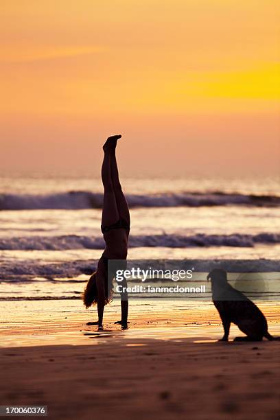 handstand - handstand beach stock pictures, royalty-free photos & images