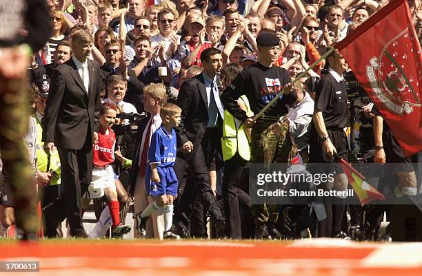 Arsenal manager Arsene Wenger and retired Chelsea player Roberto Di Matteo lead out their teams for the AXA FA Cup Final between Arsenal and Chelsea...