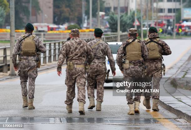 Members of Turkish Police Special Forces secure the area near the Interior Ministry following a bomb attack in Ankara, on October 1 leaving two...