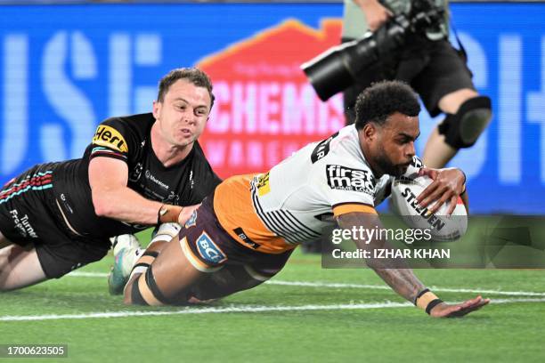 Ezra Mam of the Broncos scores a try during the 2023 NRL Grand Final match between Penrith Panthers and Brisbane Broncos at Accor Stadium in Sydney...