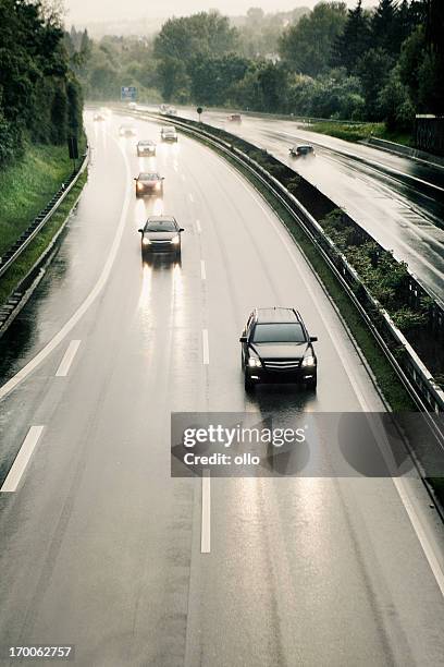 rain on highway - overtaking stock pictures, royalty-free photos & images