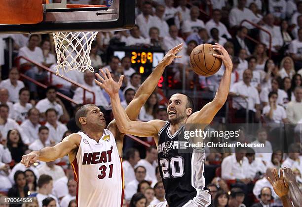 Manu Ginobili of the San Antonio Spurs goes up for a shot against Shane Battier of the Miami Heat in the first half during Game One of the 2013 NBA...