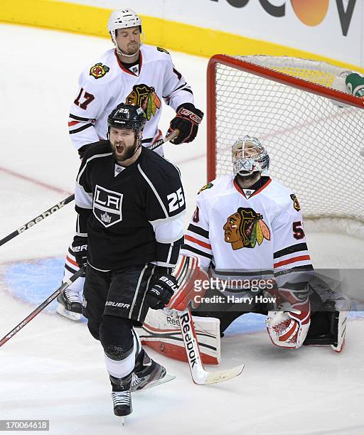 Dustin Penner of the Los Angeles Kings reacts after scoring against goaltender Corey Crawford of the Chicago Blackhawks in the second period of Game...