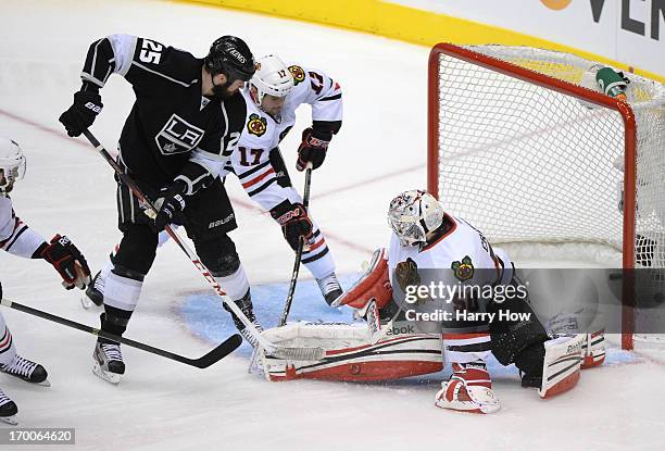 Dustin Penner of the Los Angeles Kings scores against goaltender Corey Crawford of the Chicago Blackhawks in the second period of Game Four of the...