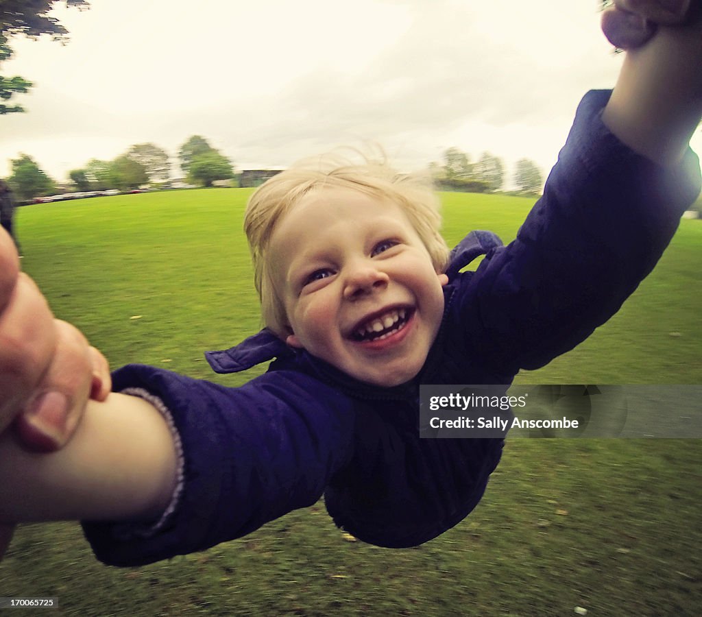 Happy smiling child having fun in the park