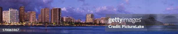 waikiki cityscape and diamond head dusk panorama - hawaii panoramic stock pictures, royalty-free photos & images