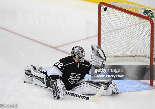 Goaltender Jonathan Quick of the Los Angeles Kings can't make the save on the shot for a goal from the top of the left faceoff circle by Marian Hossa...