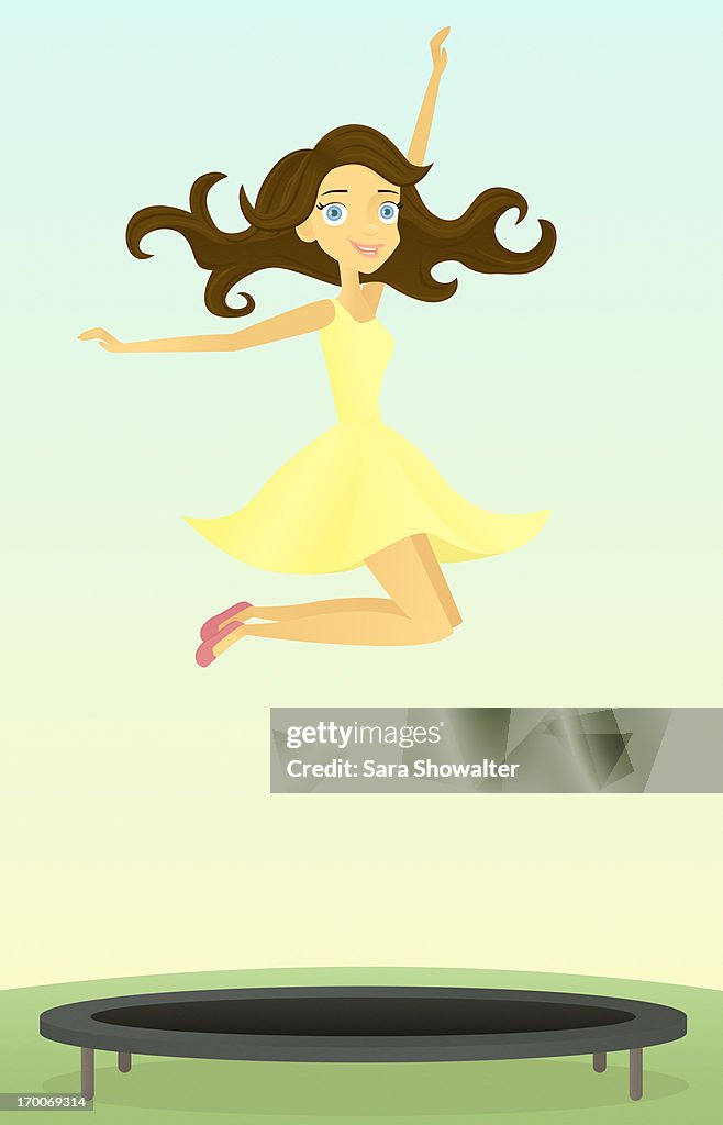 A woman jumping on a trampoline