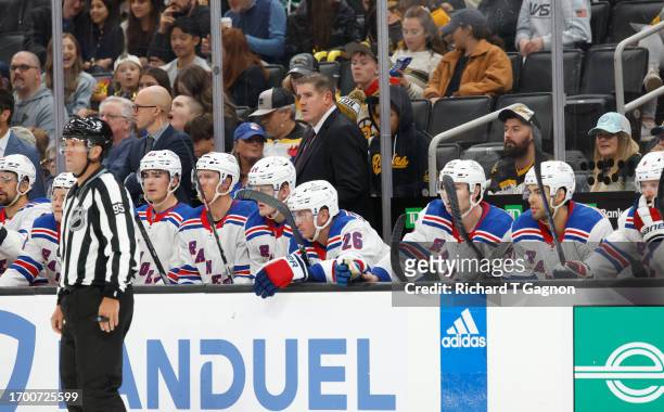 Head coach Peter Laviolette of the New York Rangers stands behind the bench during the second period of a preseason game against the Boston Bruins at...