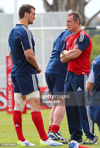 British and Irish Lions captain Sam Warburton talks with Lions Assistant Coach Rob Howley before a rugby training session at the Anglican Church...