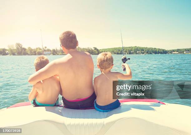 family time at the lake fishing  - father son sailing stock pictures, royalty-free photos & images