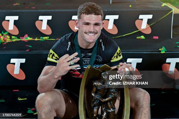 Nathan Cleary of the Panthers celebrates with the trophy after winning the 2023 NRL Grand Final match between Penrith Panthers and Brisbane Broncos...