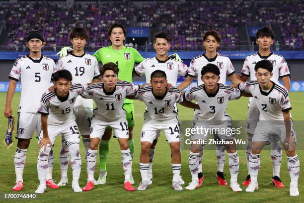 Players of Japan line uo for team photo during the 19th Asian Game Men Group D match between Palestine and Japan at Xiaoshan Sports Centre Stadium on...