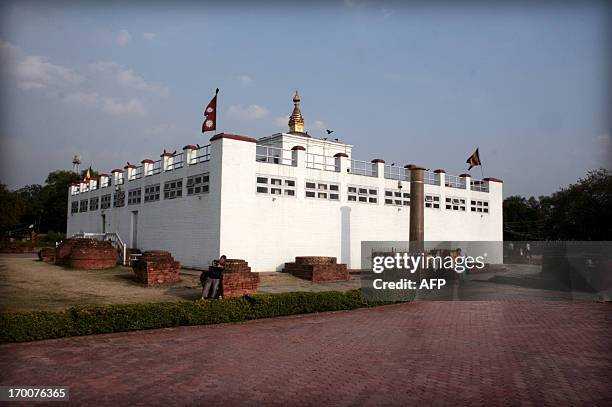 Visitors gather at the Maya Devi Temple in Lumbini some 200kms west of Kathmandu on April 17, 2013. The temple is dedicated to Buddha's mother and is...