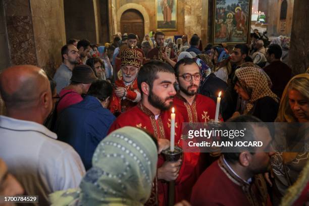 Father Shahe Hayrapetyan leads a service for the Nagorny Karabakh refugees at the Saint-Sargis vicarial church as part of the nationwide prayer for...