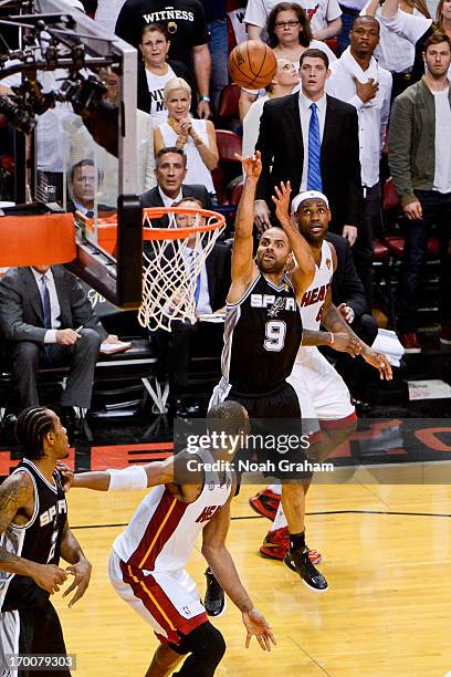 Tony Parker of the San Antonio Spurs makes a shot with seconds left in the fourth quarter to put his team ahead by four points against LeBron James...