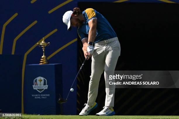 Europe's English golfer, Tommy Fleetwood plays from the 1st tee during his singles match against US golfer, Rickie Fowler on the final day of play in...