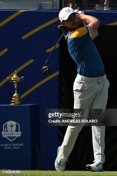 Europe's English golfer, Tommy Fleetwood watches his drive from the 1st tee during his singles match against US golfer, Rickie Fowler on the final...