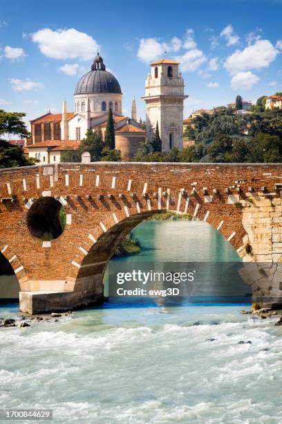 holidays in italy - ponte pietra or pons marmoreus on adige river in verona - verona italy stock pictures, royalty-free photos & images